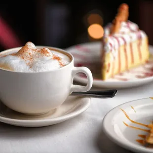 Cappuccino with Limoncello Mousse Cake topped with a butter cookie and a pear almond torte on the side