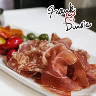 a platter of meat and vegetables