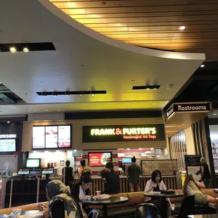 Corner of the food court. Had a good bratwurst without. Taking the bank. Mary was super accommodating and friendly.
