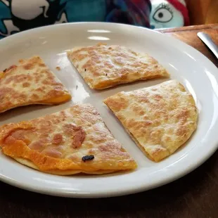 four slices of pizza on a plate