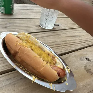 Hotdog with chili and cheese she had two of them , absolutely devoured them