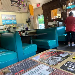 a man standing in a diner