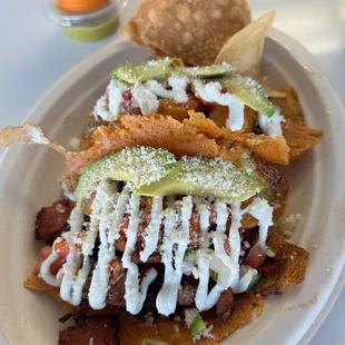 Tacos - one with birria and one with bacon