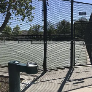 Tennis courts w/ water fountain