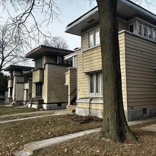 3 of 4 duplexes; one was smothered in vinyl siding in the 80s.