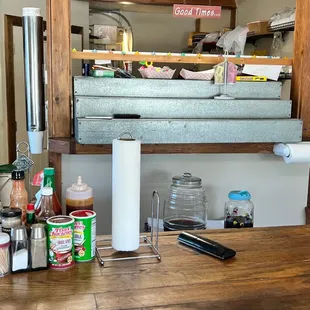 ows a kitchen counter with various condiments