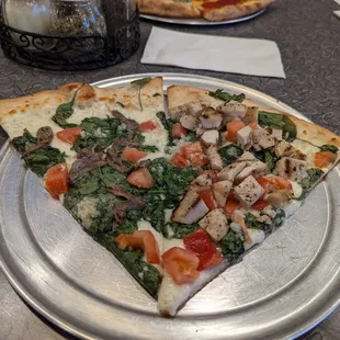 2 tomato and spinach pizzas (4.50 each). Added anchovies (50 cents extra) on one slice, and grilled chicken (a dollar extra) on the other.