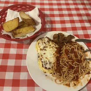 Half Spaghetti &amp; meatballs half Ravioli with meat sauce. Garlic bread comes with meal.