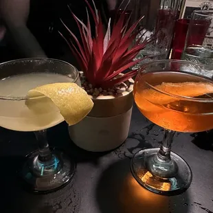two cocktails on a bar table