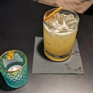 a glass of lemonade next to a glass of lemonade
