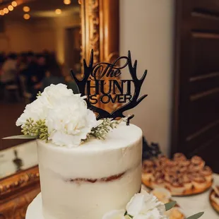 a wedding cake decorated with flowers