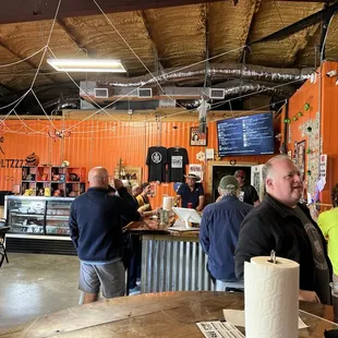 a group of people at a bar