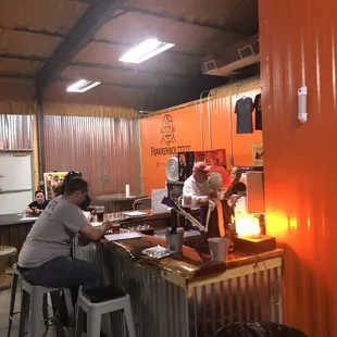 a group of people sitting at a bar