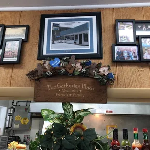 a variety of framed pictures on the wall