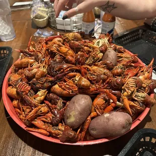 a bowl of craws and potatoes