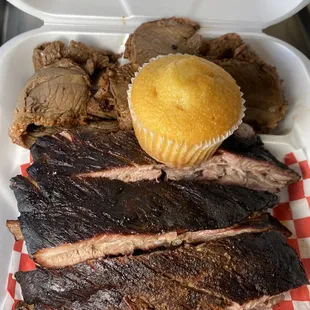 ows a tray of ribs, brisk, and a muffin