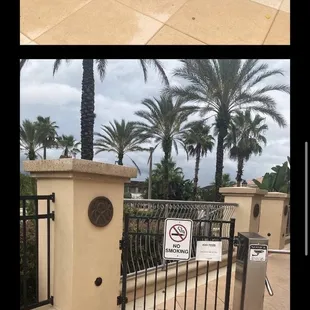 a picture of a gate with a no parking sign