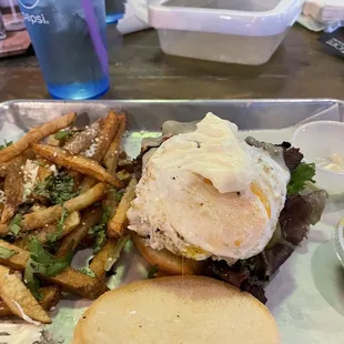 BYOB 5.3 oz burger with bacon, egg, pepper jack cheese and fries with cilantro and queso fresco.