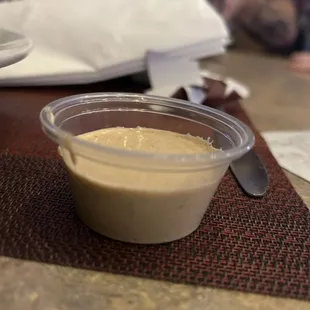 Charged $1 when asked for sauce for the nearly sauce less wings and they didn't even fill it