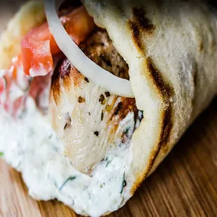 Souvlaki on Pita ($10): Greek seasoned pork tenderloin kabob on a pita served with tomatoes, onions, and tzatziki sauce.