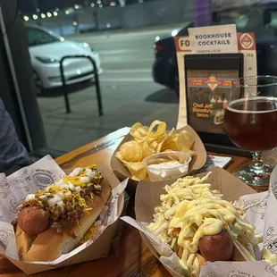 two hotdogs and french fries