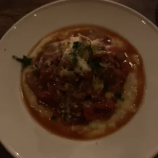 Sweet Sausage, Roasted Red Peppers, and Onions over Polenta