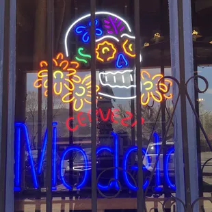 a neon sign in the window