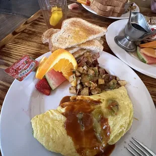 Avocado, bacon and cheese omelette with red and green chili