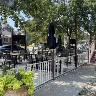 a patio with tables and chairs