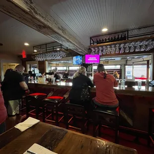 people sitting at the bar