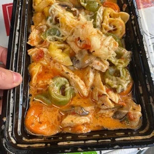 a person holding a container of food