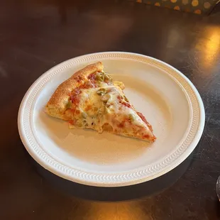 Single slice of pizza pepperoni and green olive