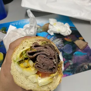 Inside the pastrami sandwich with everything. Large is 2 halves. I couldn't finish it and am saving it for later!