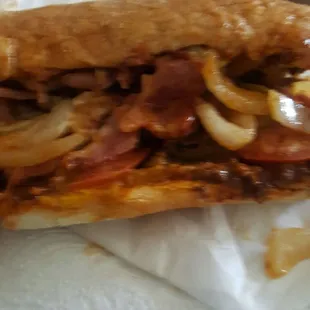 Pastrami chili cheese with grilled onions and tomatoes