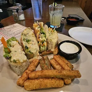 Veggie rolls. Fresh Veggies with Spanish rice and queso with zucchini fries