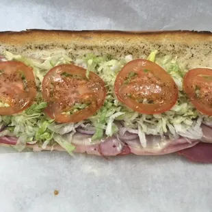 REAL Italian hoagie, packed full of authentic Italian deli meats and provolone cheese, topped with our own homemade sub dressing