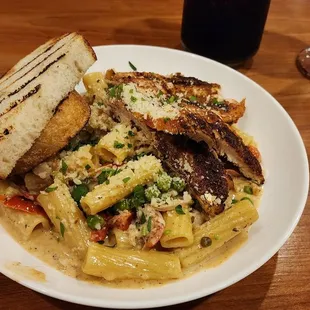 The Cajun Chicken Pasta is a delectable dish that caters to individuals who prefer a moderate level of spiciness.
