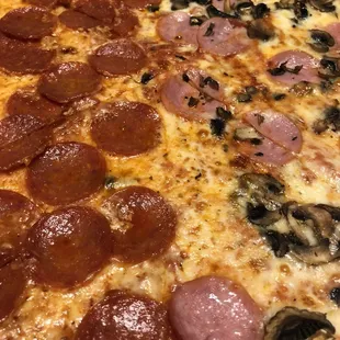 Delicious carry out pizza! Half mushroom / ham, and half pepperoni!