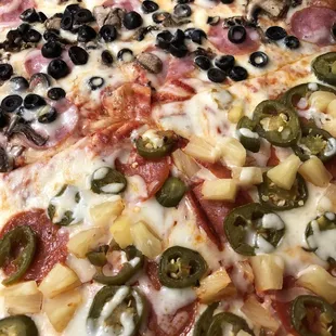 Large half pepperoni, jalapeño, and pineapple / half mushroom, ham, and black olives. DELICIOUS!
