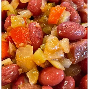 a close up of a bowl of beans and carrots