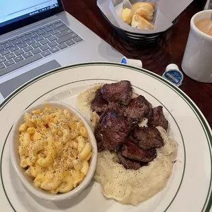 Tender Beef Medallions with mashed potatoes and macaroni &amp; cheese.