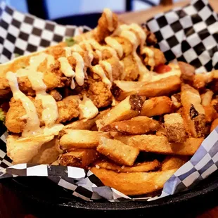 Cod fish po&apos; boy covered in spicy aoli and a side of fries, $12.95