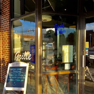 a sign in front of a restaurant