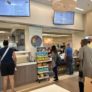 customers ordering food at the counter