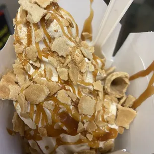 Vanilla soft serve, caramel, waffle cone pieces