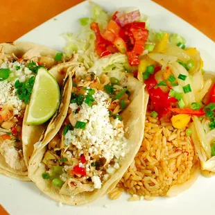 a plate of tacos and rice