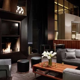a modern living room with a fireplace