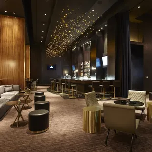 a bar and lounge area in a hotel