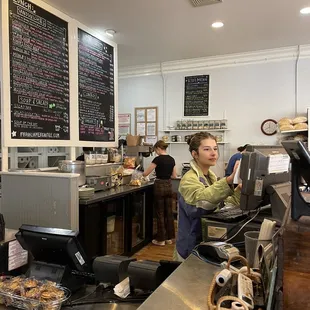 a woman working behind the counter