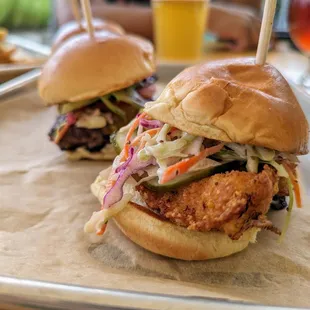 Sliders. $15. Cheeseburgers. Baldwin Beef (Yanceyville, NC), pickled onion, garlic aioli. Cajun-fried Chicken, pickles, slaw. Brioche.